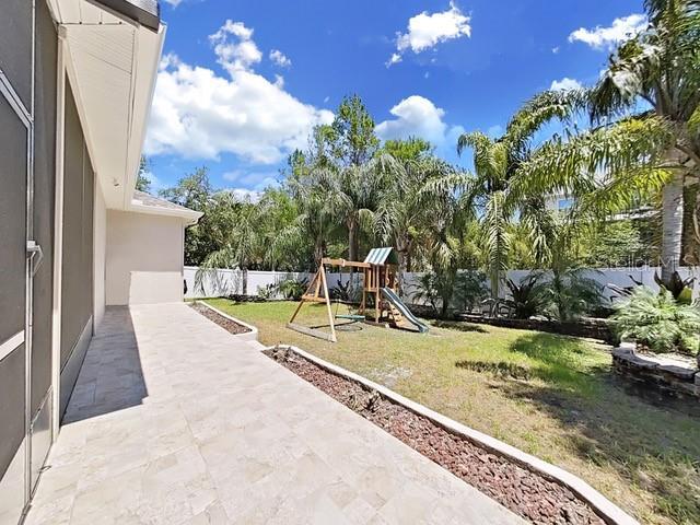 view of patio with a playground