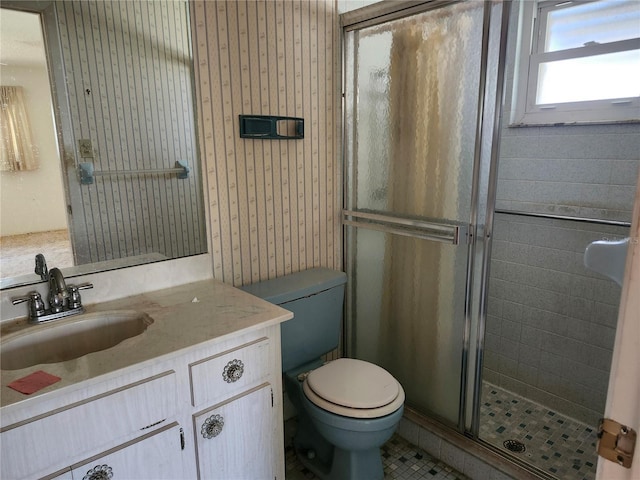 bathroom featuring vanity, tile patterned flooring, a shower stall, and toilet