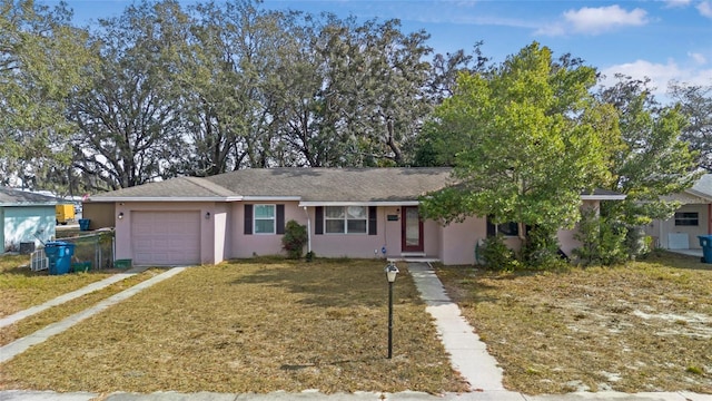 view of front facade featuring a garage and a front yard