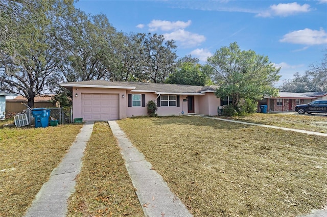 view of front facade featuring a garage and a front lawn