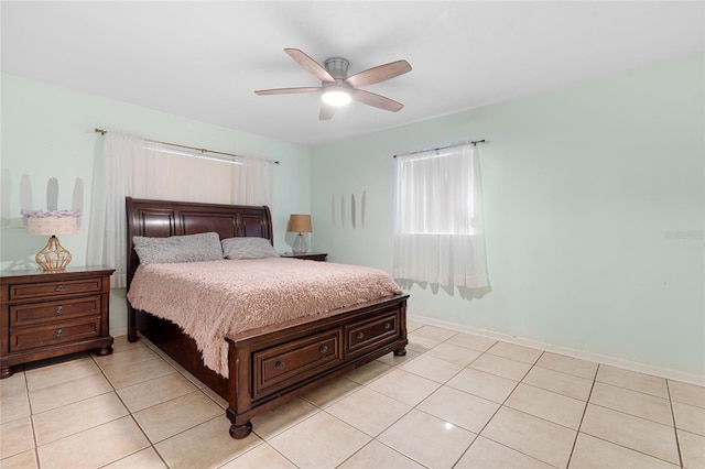 tiled bedroom with ceiling fan