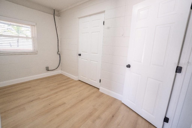 spare room featuring light hardwood / wood-style flooring