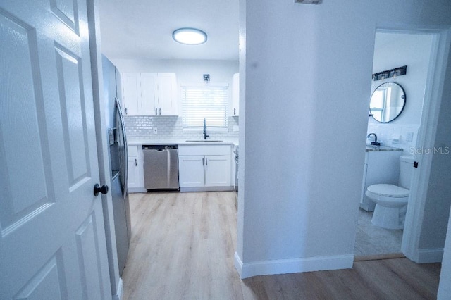 interior space featuring sink and light hardwood / wood-style floors