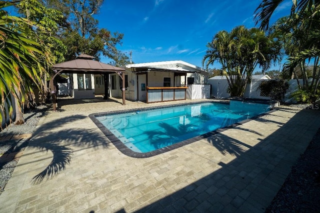 view of swimming pool with a gazebo and a patio area