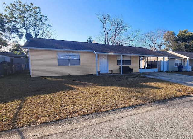 single story home with a carport and a front yard