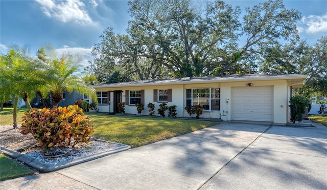 ranch-style home with a garage and a front lawn