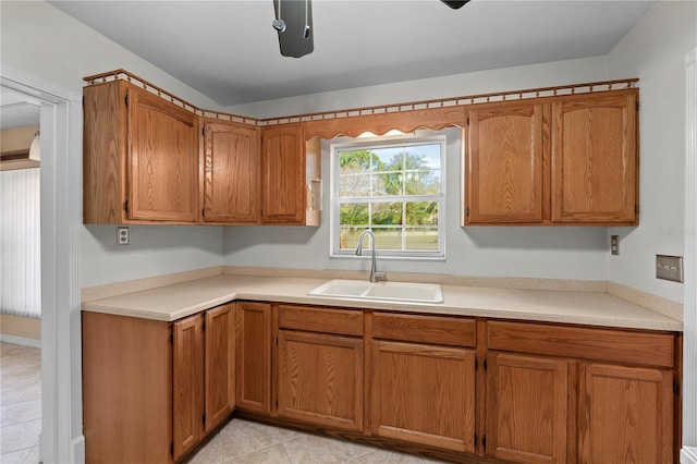 kitchen with sink and light tile patterned floors