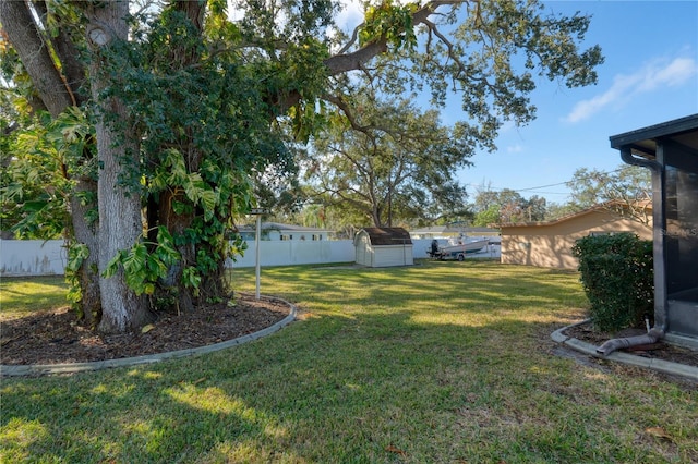 view of yard with a storage unit