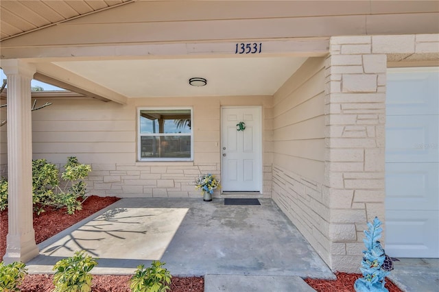 doorway to property featuring a garage