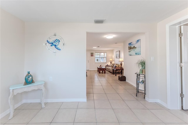 corridor featuring light tile patterned floors