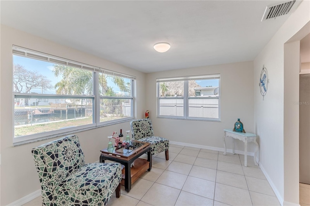 living area with light tile patterned floors