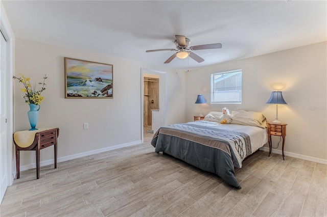 bedroom featuring ensuite bathroom, ceiling fan, and light hardwood / wood-style floors