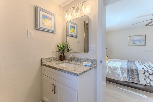 bathroom with ceiling fan and vanity