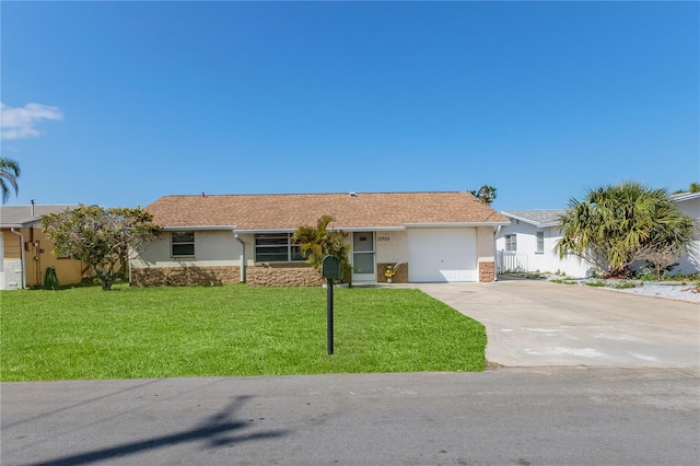 single story home with a front yard and a garage