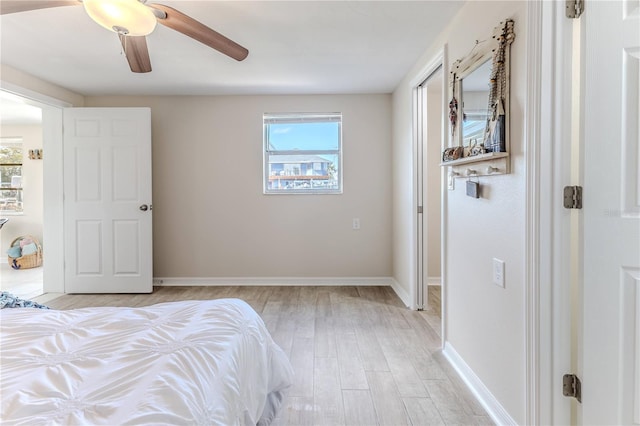 bedroom with ceiling fan and light hardwood / wood-style floors