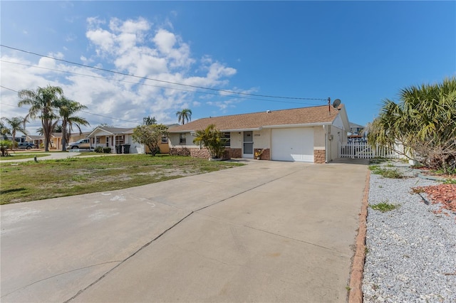 single story home with a front lawn and a garage