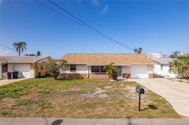 single story home featuring a front lawn and a garage