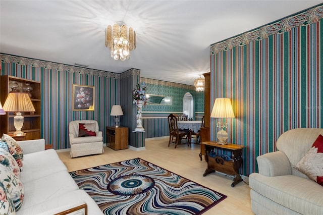 living room with an inviting chandelier and carpet