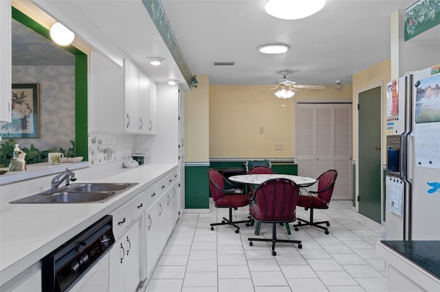 kitchen with sink, light tile patterned floors, dishwasher, ceiling fan, and white cabinetry