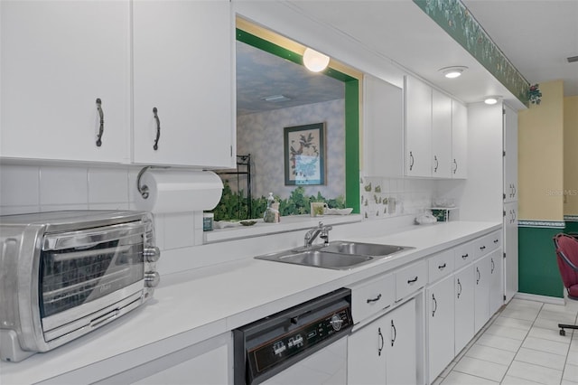 kitchen with white cabinetry, dishwasher, sink, and light tile patterned floors