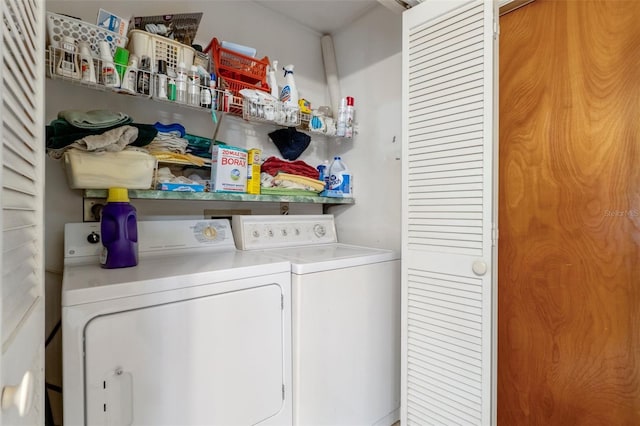 washroom featuring washer and dryer