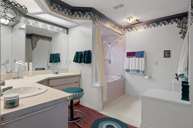 bathroom with tile patterned floors and vanity