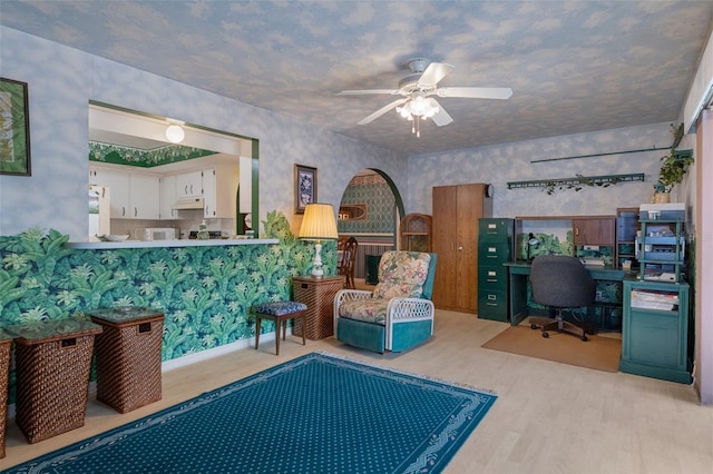 interior space with light hardwood / wood-style flooring and ceiling fan