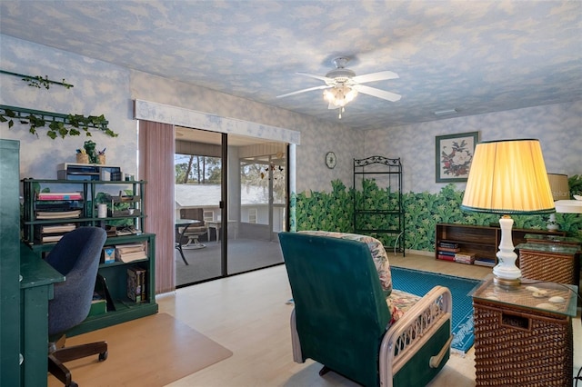 office space featuring light hardwood / wood-style floors and ceiling fan