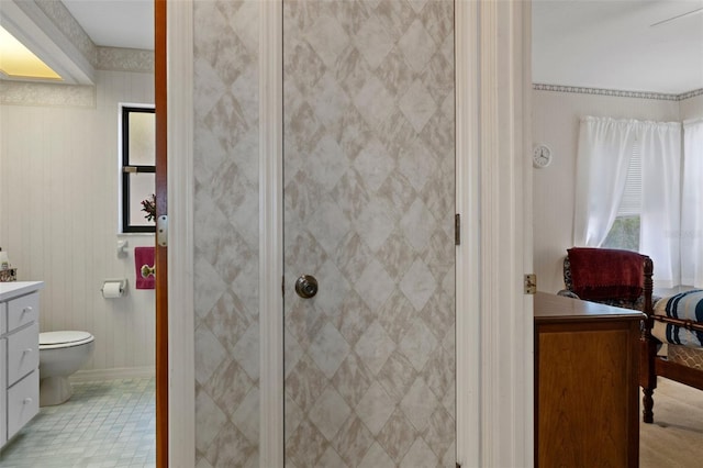 bathroom with vanity, an enclosed shower, and toilet