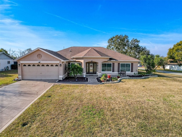 ranch-style house featuring a garage and a front yard