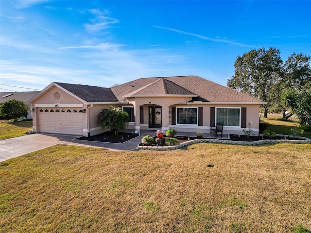 ranch-style home featuring a garage and a front yard