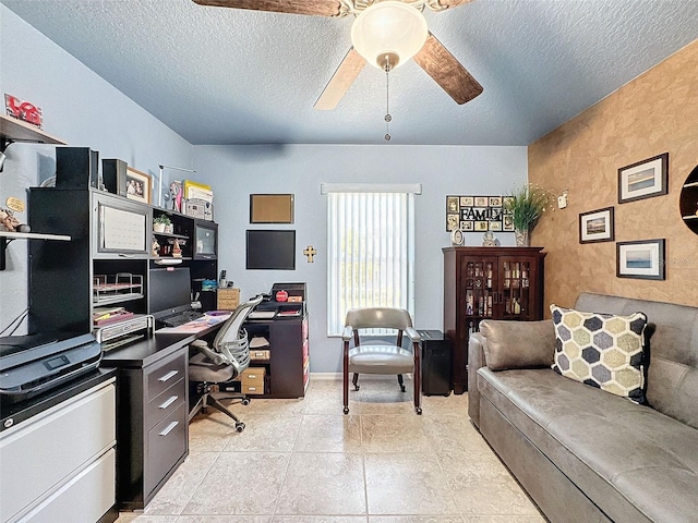 office space with light tile patterned floors, a textured ceiling, and ceiling fan