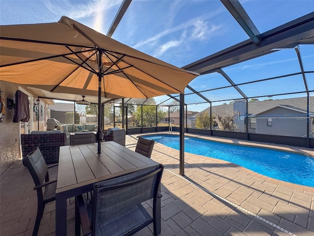 view of pool featuring a lanai, an outdoor hangout area, and a patio area