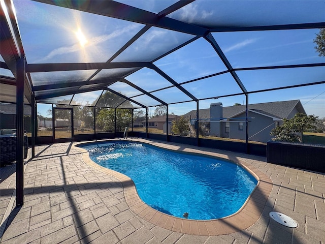 view of pool featuring a patio and a lanai