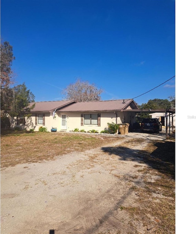 view of front of house with a carport