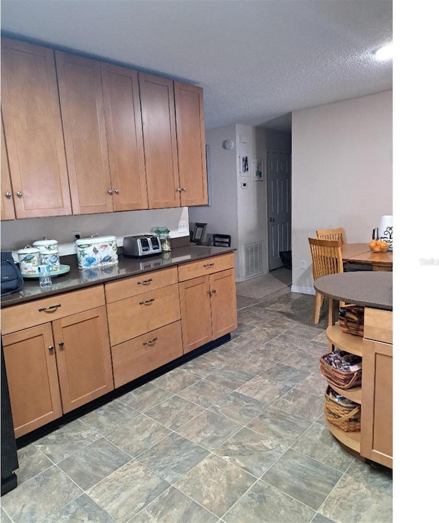 kitchen with a textured ceiling