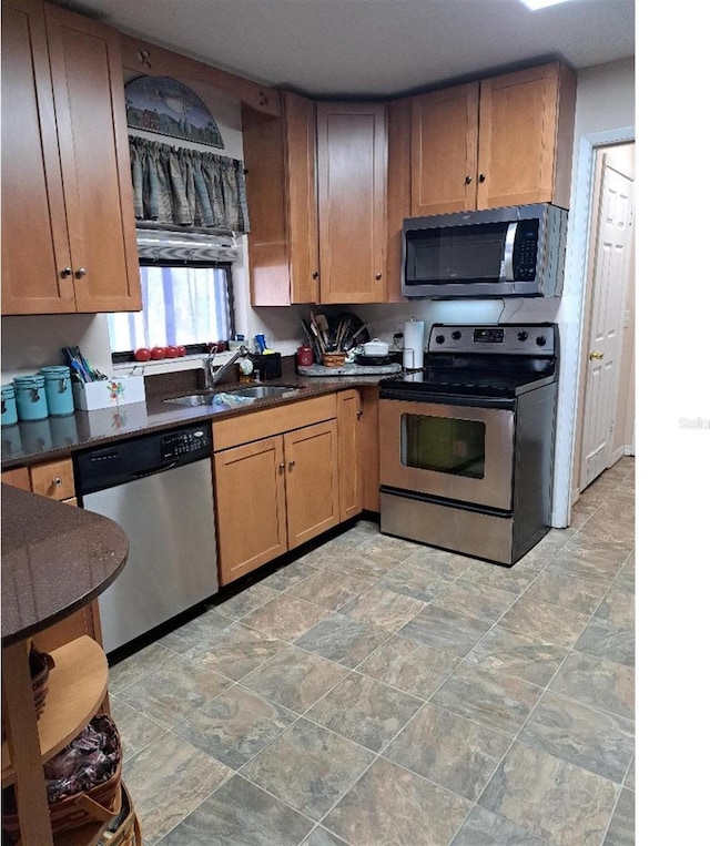 kitchen featuring appliances with stainless steel finishes and sink