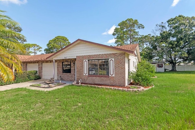 view of front facade featuring a garage and a front lawn