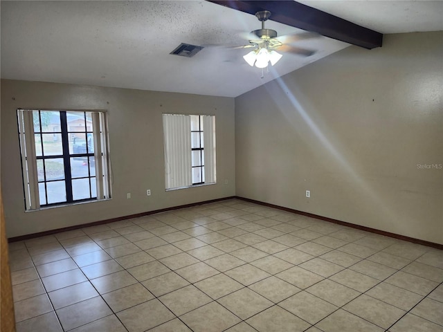 spare room with ceiling fan and lofted ceiling with beams