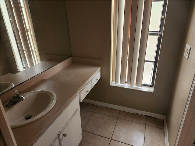 bathroom with tile patterned flooring and sink