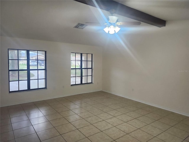 unfurnished room with light tile patterned floors, beam ceiling, ceiling fan, and baseboards