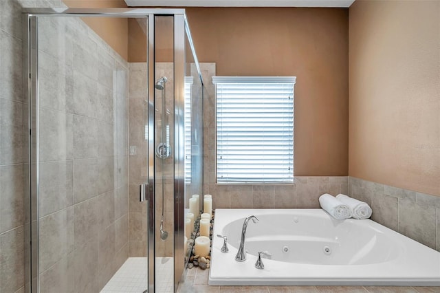 bathroom with shower with separate bathtub