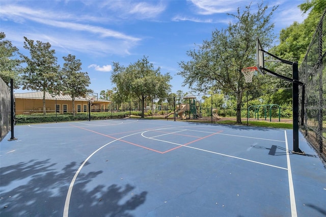 view of sport court with a playground