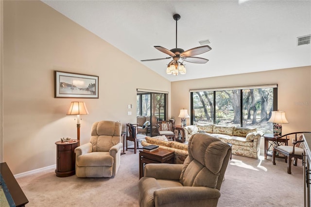 living room featuring high vaulted ceiling, light colored carpet, and a healthy amount of sunlight