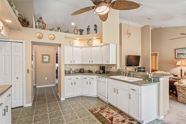 kitchen featuring white dishwasher and white cabinets