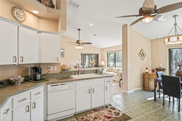 kitchen featuring sink, light tile patterned floors, dishwasher, ceiling fan, and white cabinets