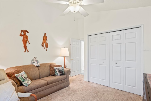 carpeted living room featuring vaulted ceiling and ceiling fan