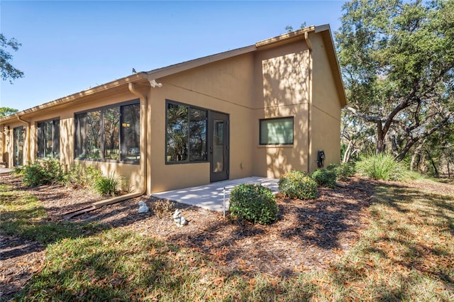 back of house with a patio area