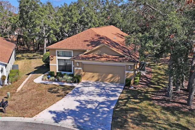 view of front of property with a garage and a front yard