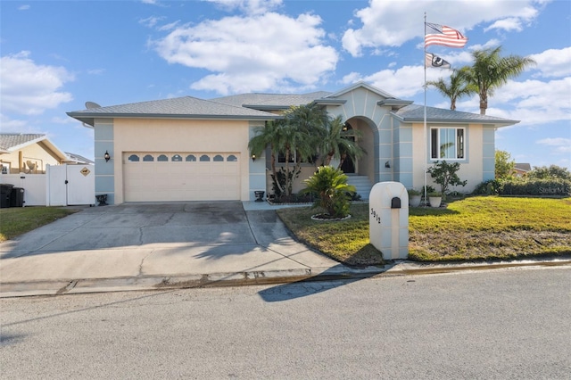 ranch-style house with a garage and a front lawn